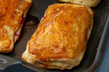 Close-up of puff pastry. Homemade cookie dough pies. Baking cooking concept.