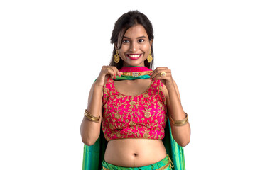 Beautiful girl showing Rakhi on occasion of Raksha bandhan on a white background. Sister tie Rakhi as symbol of intense love for her brother.