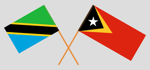 Crossed flags of Tanzania and East Timor. Official colors. Correct proportion