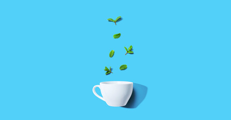 Fresh mints with tea cup overhead view