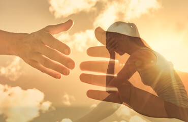 Hand reaching out to help a sad young woman. Salvation, getting help from a friend.  - obrazy, fototapety, plakaty