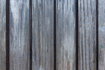 Textured wall surface made of old gray wooden planks