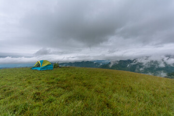 Camping atop a mountain on a misty summer’s day.