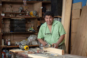 Portrait of a Mexican carpenter on his workshop