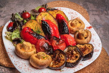 Juicy vegetables - grilled on a white plate. Vegetables - barbecue. Baked vegetables. 