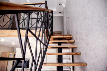 wooden staircase in a house - obrazy, fototapety, plakaty