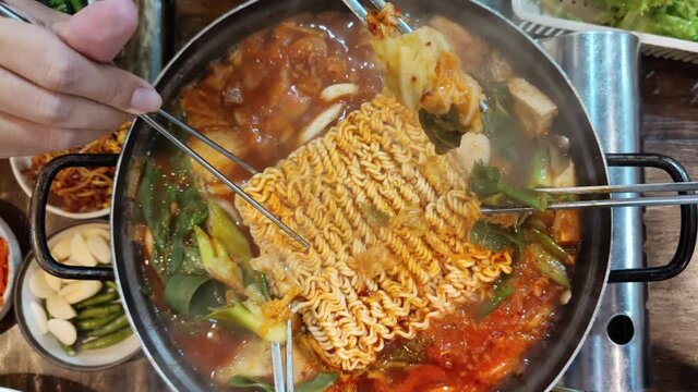 Eating dinner Korean ramen with friends, close-up Korean noodles Taken with a top view camera