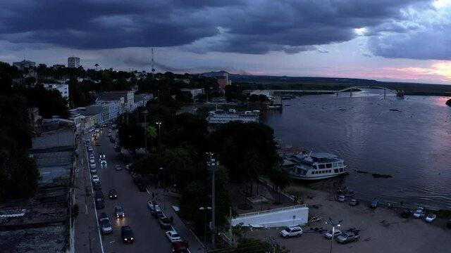 The city of Corumba, Brazil and the Rio Paraguay at twilight with dark clouds over the historic 