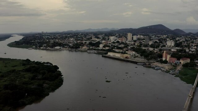 Flying over the Rio Paraguay toward Corumba, Brazil - push forward ascending aerial view