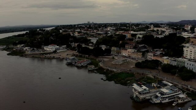 The city of Corumba, Brazil along the shore of the Rio Paraguay - push in tilt down aerial view