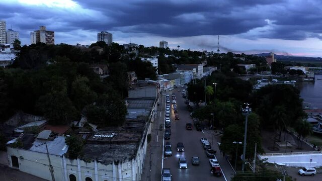 The city and streets of Corumba, Brazil at night with a stormy twilight sky - aerial view