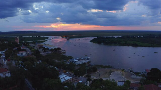 Corumba, Brazil and the Rio Paraguay during a brilliantly colorful sunset - aerial view 