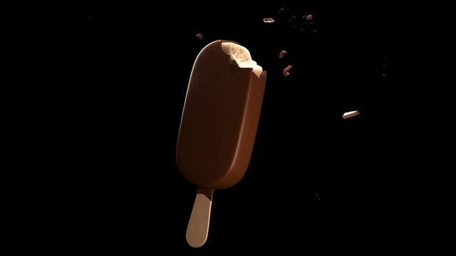 Bites on a chocolate ice lolly. Slow motion rotation with crumbles. High quality 4k footage