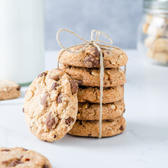 Chocolate chip cookies with milk on marble