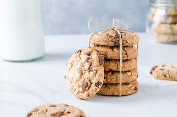 Chocolate chip cookies with milk on marble