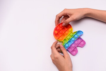 fighting stress. pop it antistress. silicone rubber toy with bubbles to push them. close-up on a white background. layout, mock up