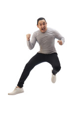 Asian man wearing grey shirt black denim and white shoes, jump while screaming shouting celebrating victory, winning gesture