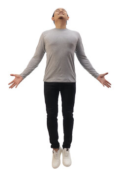 Asian man wearing grey shirt black denim and white shoes, jump flying levitation, happy expression. Full body portrait isolated