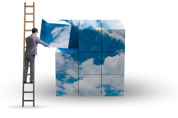 Businessman building cloud cube with shapes