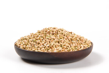 Pile of raw buckwheat isolated on white background.