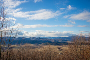 Idyllic rural view of gently rolling patchwork farmland and villages with pretty wooded boundaries, in the beautiful surroundings