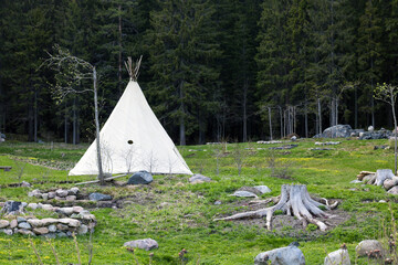 Summer wigwam in an open area near the forest in the afternoon or in the morning © Marina