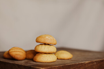 Stack of homemade cookies on wooden board. Baking in country kitchen.