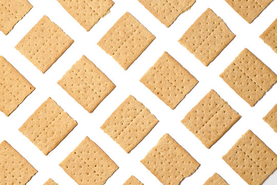 Pattern of graham crackers squares. Top view, flat lay, isolated on a white background