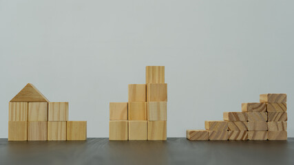 Wooden cubes or pyramid-shaped wooden blocks on the tabletop for white copy space and text entry.