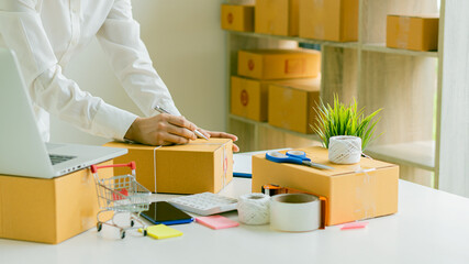 Young Asian business woman working online in a computer copyspace work desk. Successful business worker, freelance SME online marketing at home, coworking space concept.