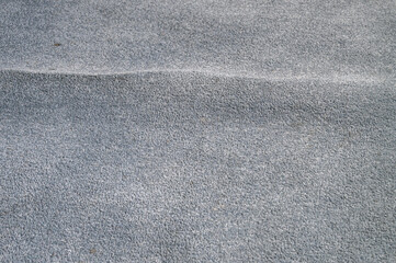 Old, stained, and wrinkled blue carpet poses a tripping hazard, home interior
