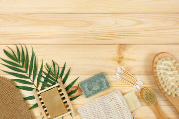 Natural cleaning bamboo, coconut dish brushes on wooden table. Eco friendly with No plastic kitchen and home cleaning. Top view, flat lay. Sustainable lifestyle, Zero waste concept.