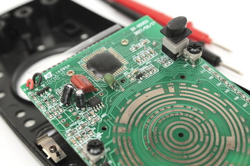 Broken digital multimeter isolated on white background