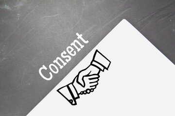white paper with words of consent and a dark background