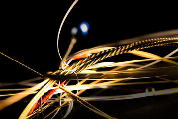 Macro Closeup of Texture on Bunch of Loose Bronze Acoustic Guitar Strings