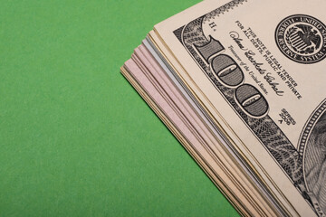 A fragment of the American dollar can be seen on the table.