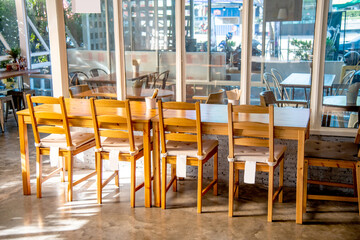 Conceptual layout of  long wooden counter bar table and chairs in loft, minimal, cozy style for recreation, relaxation and cafe, coffee shop graphical element decoration.
