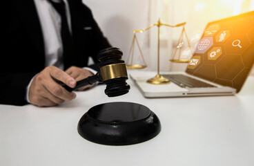 Concepts of Law and Legal services. Lawyer working with law interface icons. Blurred background.	