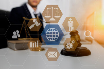 Concepts of Law and Legal services. Lawyer working with law interface icons. Blurred background.	