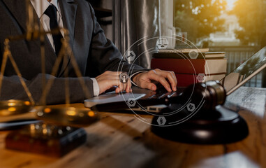 Concepts of Law and Legal services. Lawyer working with law interface icons. Blurred background.	