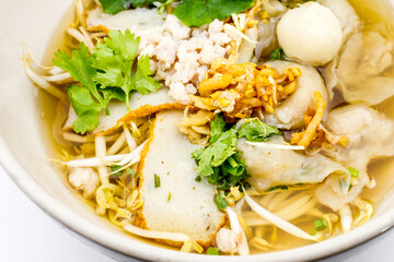 Thai style instant noodles soup in bowl, Thai food, Noodle soup on white background.