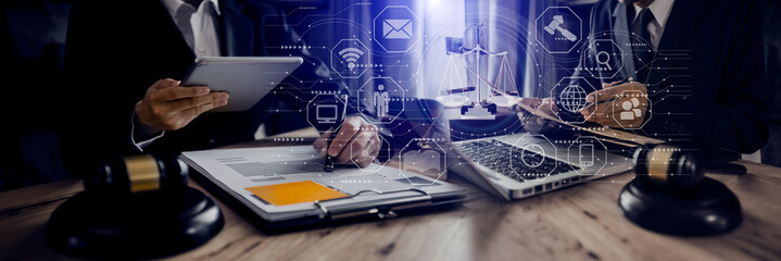 Concepts of Law and Legal services. Lawyer working with law interface icons. Blurred background.	