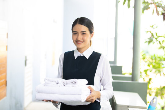 Housekeeper Or Maid Cleaning Hotel Room. Asian Woman Worker Working In Hotel And Resort.