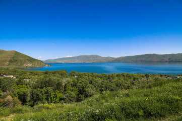 View of scenic Sevan lake in Armenia. Summertime holidays near the lake.