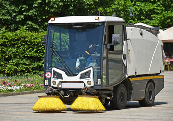 Street cleaner vehicle in the city