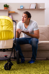 Young male contractor looking after new born at home