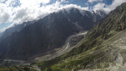 Fototapeta na wymiar Caucasus, Ossetia. Tsey gorge. View of the Icefall from Mount Wilpat. 
