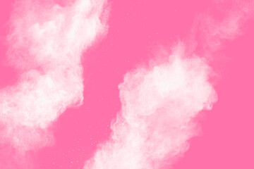 Freeze motion of white powder on pink background. Abstract white dust explosion.