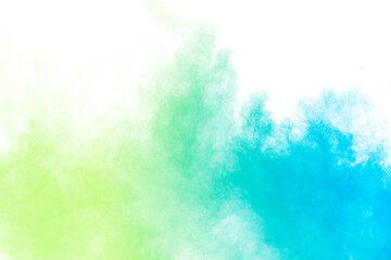 Fototapeta na wymiar Abstract blue green powder explosion on white background.Freeze motion of blue green dust cloud.