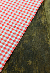 Rustic wooden boards with a red checkered tablecloth